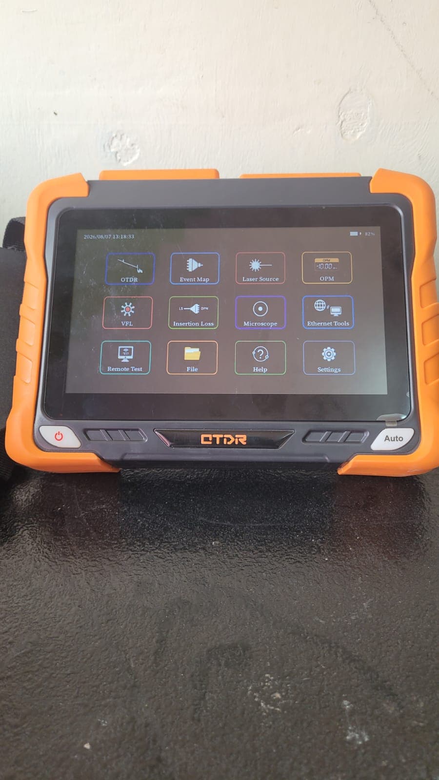 OTDR test unit screen showing optical testing and diagnostic tool options